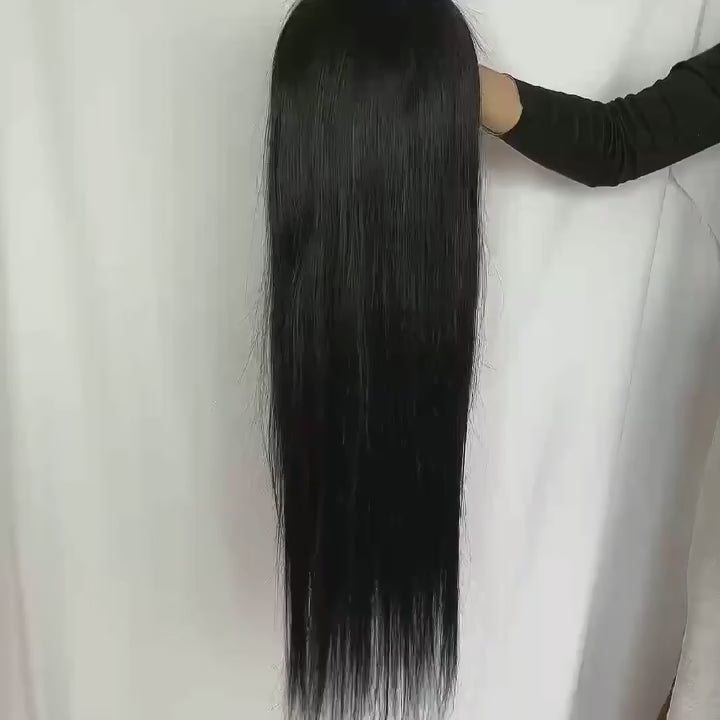 Video showcasing a long straight human hair wig, beginning with a close-up of its silky texture and smooth flow. The wig is then flipped to reveal the inner HD lace cap, highlighting the pre-cut hairline and fine lace craftsmanship.